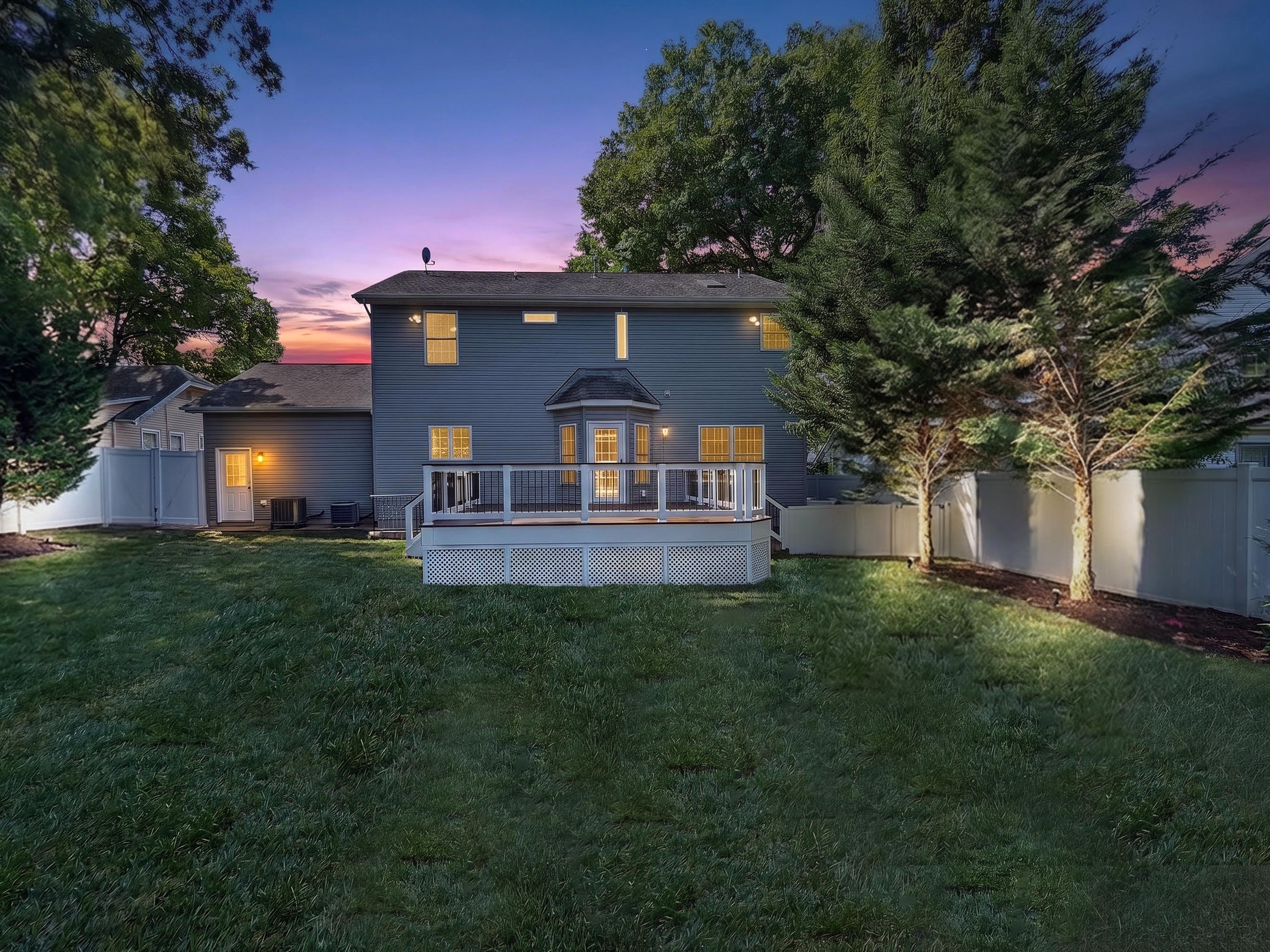 909 19th St S — back of house at twilight